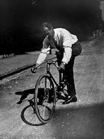 Lyonel Feininger on his Bicycle in Gutenbergst. Weimar